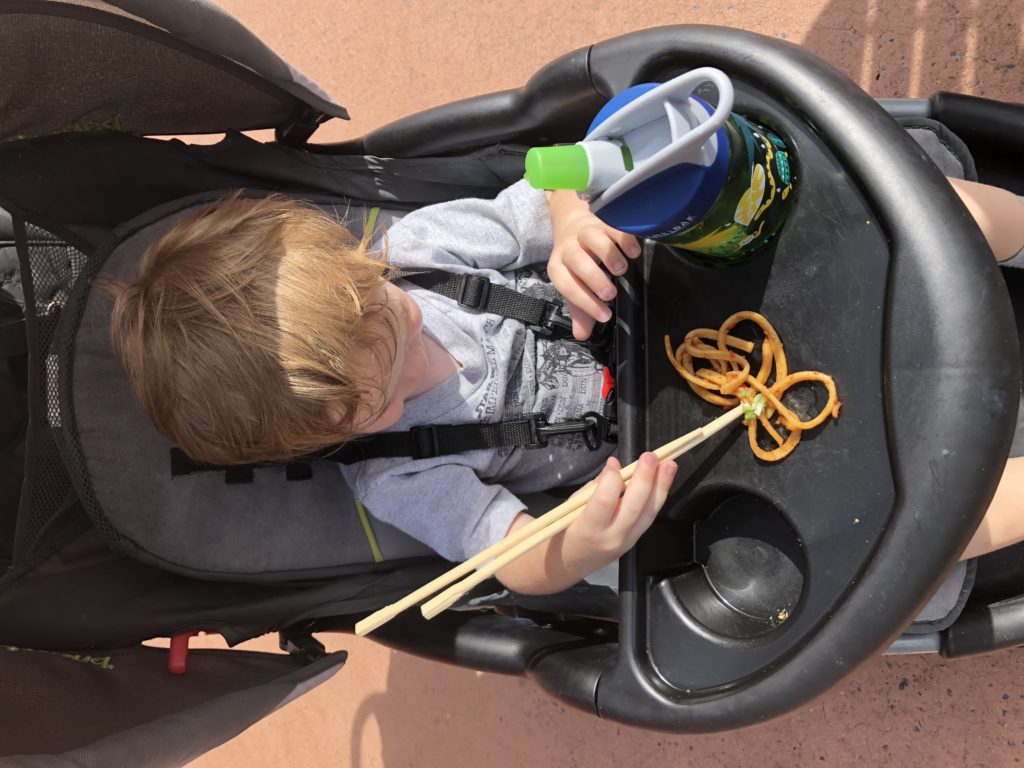 Conor practicing with the chopsticks